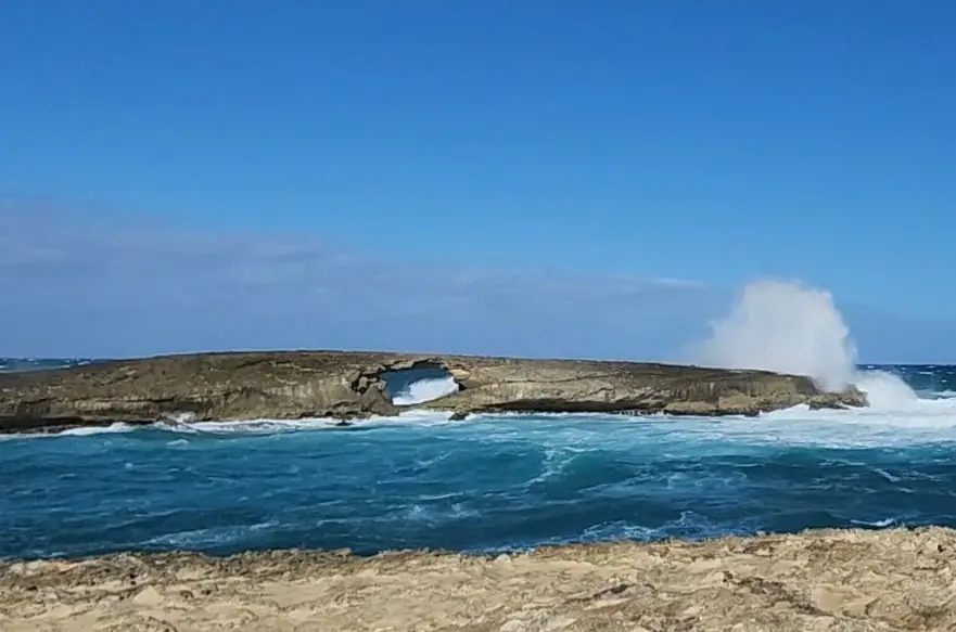 Arch on Kukuihoolua island at Laie Point, Oahu, Hawaii - Things to See and Do
